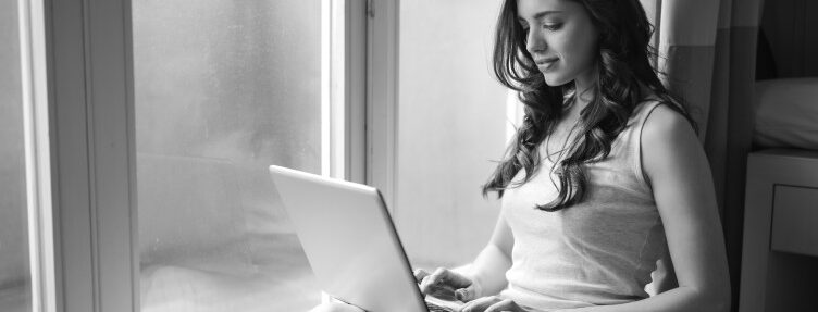 Woman typing on a laptop