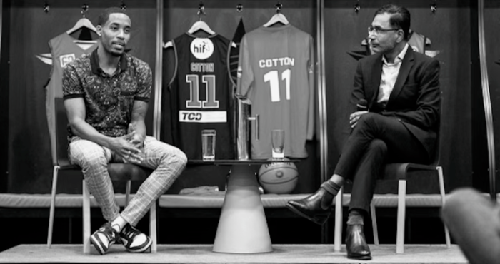 Nick Marvin speaking with a basketball player