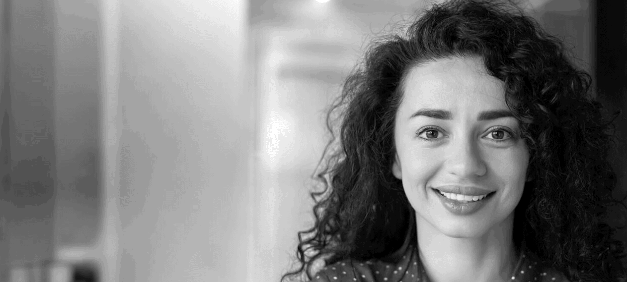 Closeup of woman smiling and looking at the camera