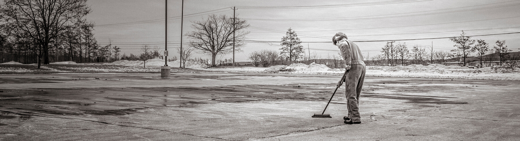 Cleaner sweeping the streets