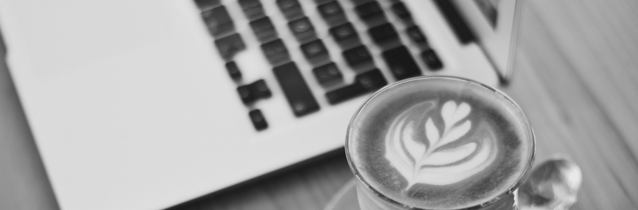 Coffee next to a laptop