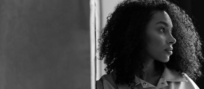 Woman looking pensive staring off into the distance