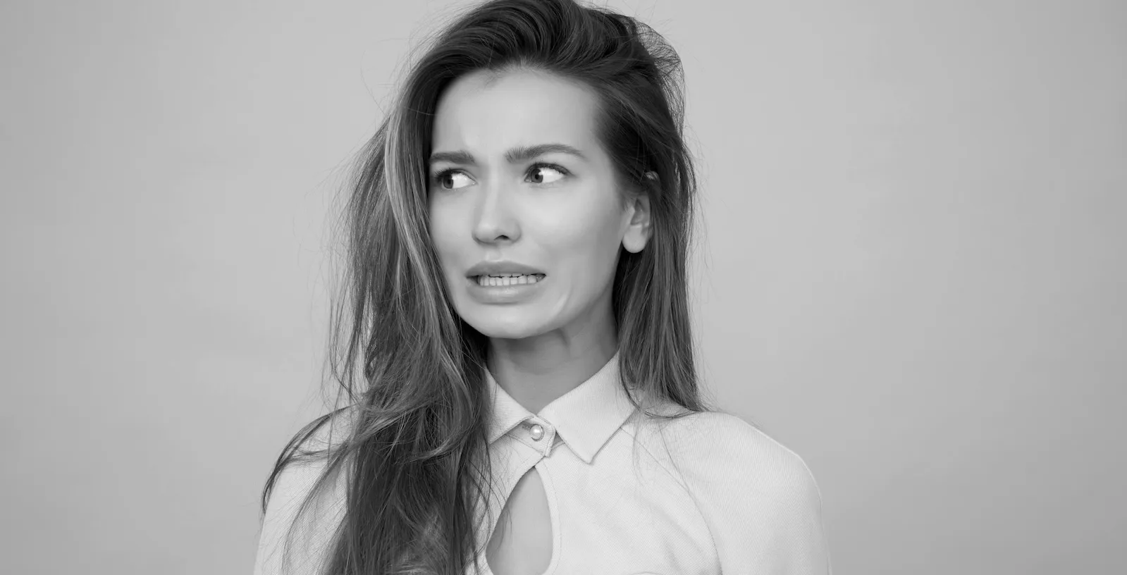 Black and white image of a woman making a weird face